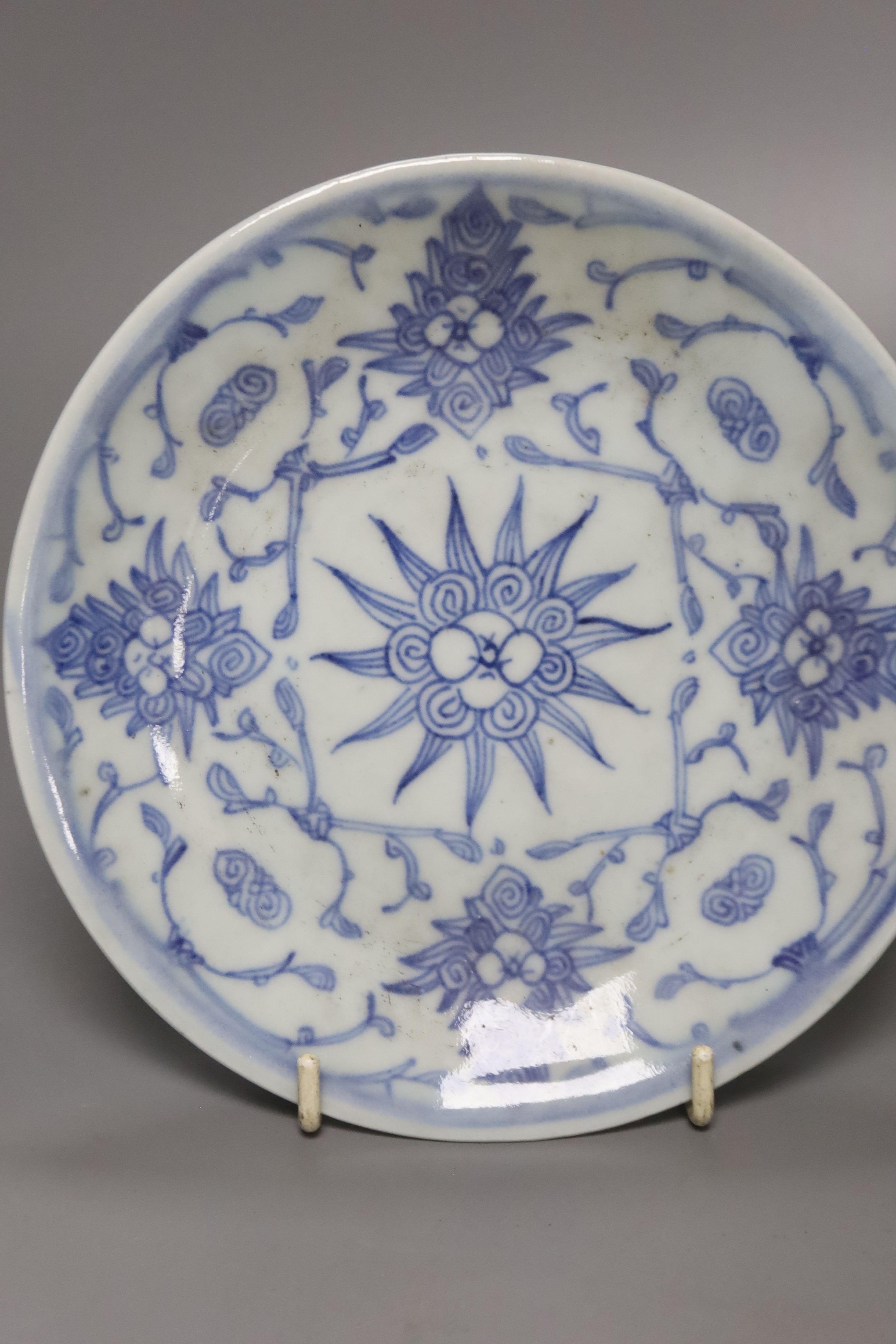 A Chinese celadon glazed vase, height 28cm, together with a crackle glaze bowl, a blue and white teabowl and saucer and a blue and white dish